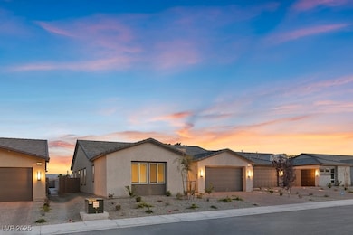 Ranch-style home featuring driveway, a garage, stu