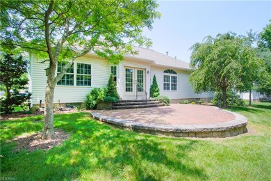 The private patio with relaxing wooded views.