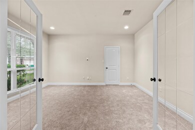 A private study through double glass doors adds a