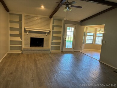 Unfurnished living room with baseboards, a ceiling