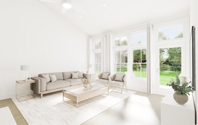 Living room with ceiling fan, high vaulted ceiling