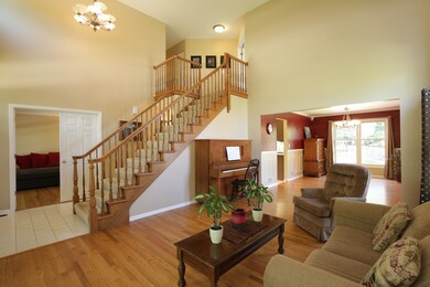 Formal living room with vaulted ceiling, hardwood 