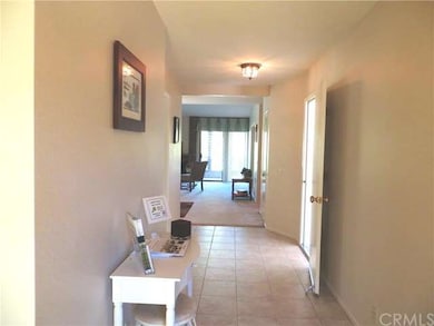 Stately entry with tile floor and direct access ga