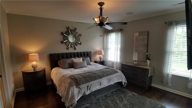 Master bedroom complete with hardwood flooring, cr