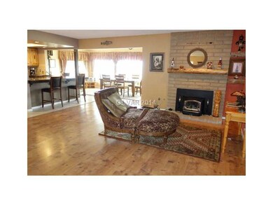 Den. Added upgraded wood burning fireplace insert