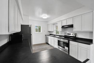 #7 - Kitchen with Close up of Counter Tops from Dining Room.jpg
