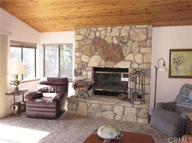 Beautiful stone wood burning fireplace with gas je