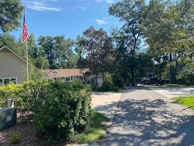 View of front of house featuring driveway and a garage