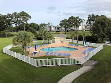View of pool with a yard and a patio