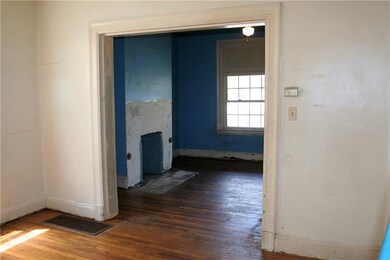 View of living room fireplace from dining room. La