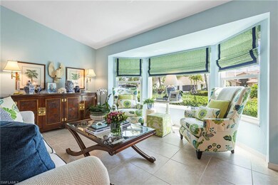 Living room featuring plenty of natural light and light tile patterned flooring