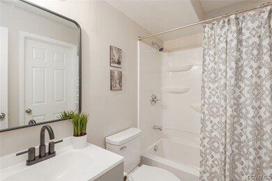 Full bathroom with shower / bath combination with