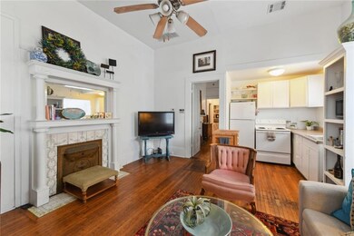 Living Room/Kitchen with Fire Place Mantel View