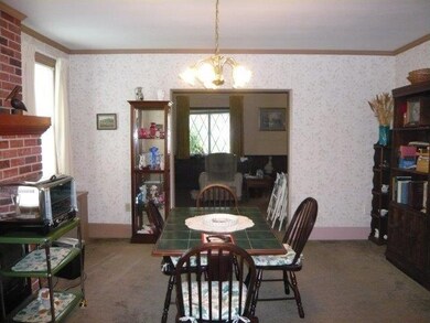 Dining room with archway to living room.  Two brig