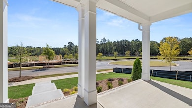 Charming Covered  Front Porch! This Porch stretches the full legnth of the home.