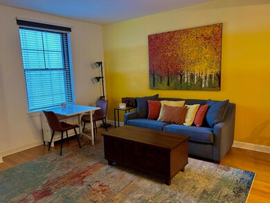 Living room with hardwood / wood-style floors