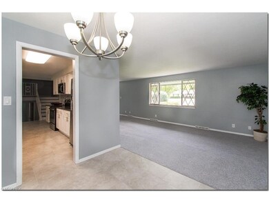 Spacious Living Room with Newer Carpeting and Dini