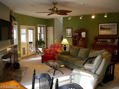 Den/Family/Great Room. View of Great Room from the kitchen.  Door in view opens to the screened in porch.
