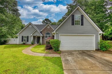 Traditional-style house featuring concrete driveway