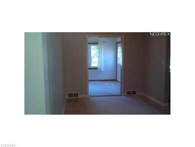 Dining room leading into den.