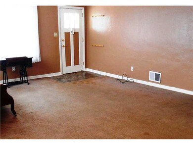 Living Room. Hard wood flooring under the carpetin