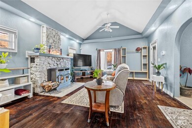 Hardwood floors and large bay window are focal points in this inviting space.