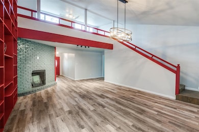 Unfurnished living room featuring lofted ceiling, 