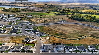 View of property location with nearby suburban area and a water and mountain view