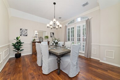 Bright dining room features a large window with sh