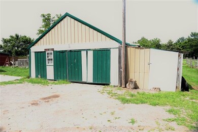 Outbuilding/garage/workshop.  Plenty deep enough t