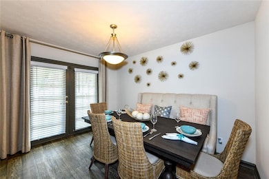 Dining room with french doors and hardwood / wood-