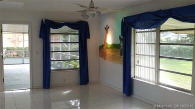 FAMILY ROOM AREA LEADING OUT TO ENCLOSED PRIVATE L