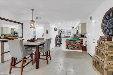 View from living area of dining area and kitchen; 
