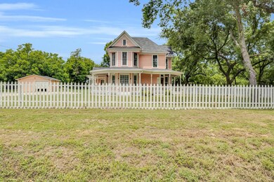 View of front of home with covered porch and a fro