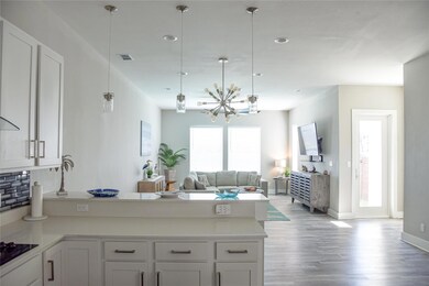 Kitchen featuring visible vents, open floor plan, 