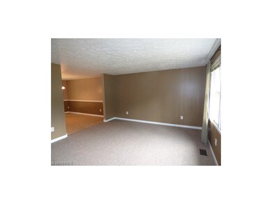 Living room leading to dining room.  Freshly paint