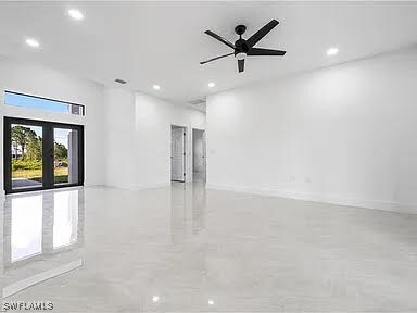 Empty room featuring ceiling fan