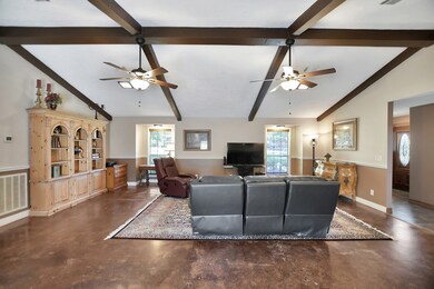 Chair railing and double-pane windows.  You will love the look of the exposed wood beams and crown molding