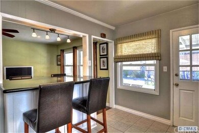 Raised dining bar with slab countertop