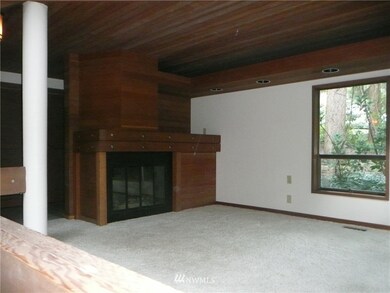At the entry to the home is the fireside room. Great for relaxing and reading.