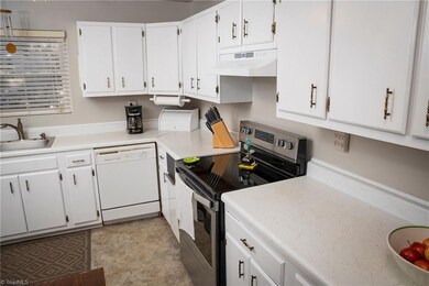 Inside, You'll Find A Kitchen With Lots Of Cabinets, A Smooth-Top Range And Sink At Front Window
