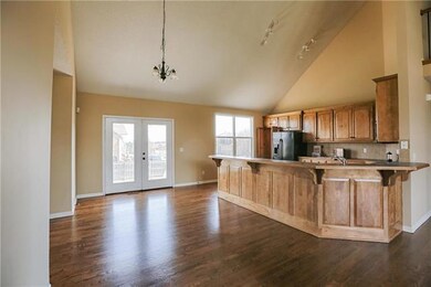 Dining area is graced by french doors & bar