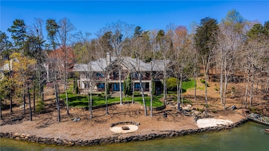 Level yard, firepit, sandy beach area, water featu