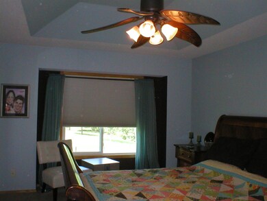 Master bedroom features coffered ceiling, walk-in 