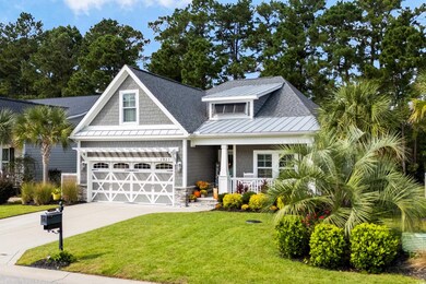 Craftsman-style house with a garage, a front yard,