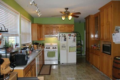 Huge Kitchen with LOTS of Cabinets! Gas stove remains with home.