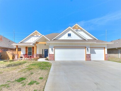 Craftsman house featuring a garage and a front yar