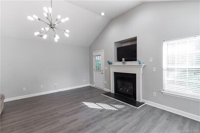 Living Room with gas fireplace and TV niche.