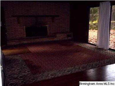 Large den with sliding glass door to back yard