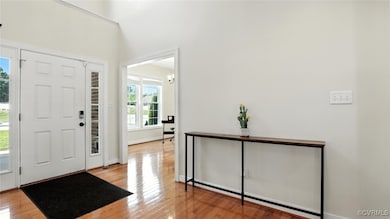 Foyer entrance featuring wood finished floors and